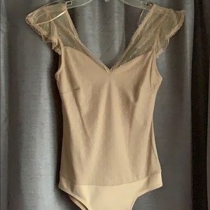 Nude lace body suit